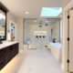 Bathroom with Marble Shower and Dark Wood